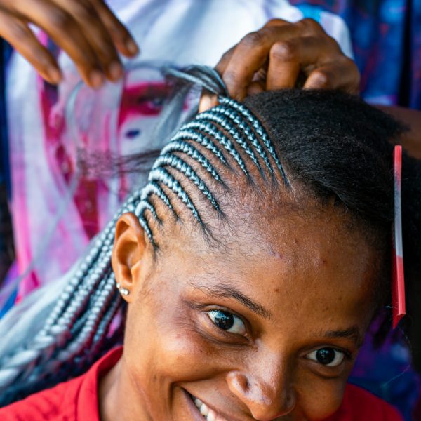 Woman getting her hair Braided